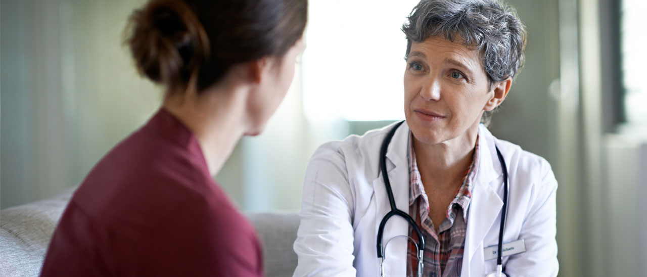 A Physician talks to her patient