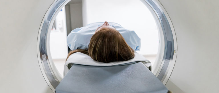 Patient being scanned by an MRI