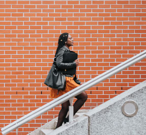 Woman walking up stairs