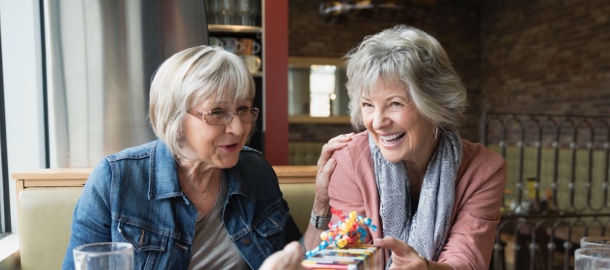 two older women laughing together