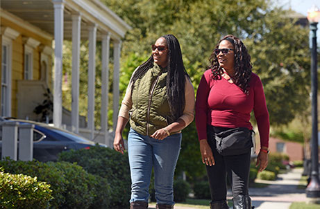 women walking smiling