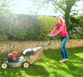 person cutting lawn